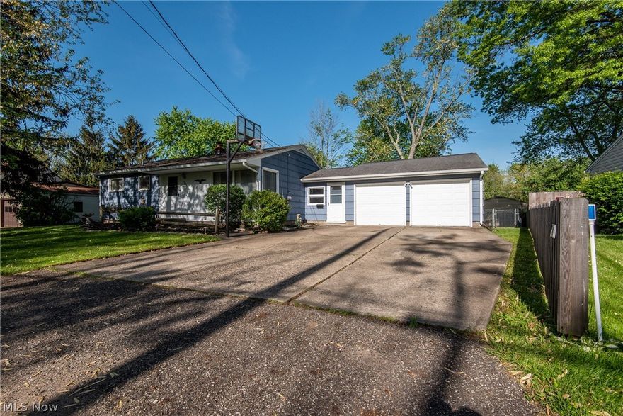 CONVENIENTLY LOCATED 3 BEDROOM RANCH IN PERRY TOWNSHIP! When you step through the front entrance, you will be greeted by the spacious living room with neutral colors, fresh paint,  and hardwood floors that flow throughout the hallway and bedrooms. The dining area, which is open to the kitchen, features new laminate floors and provides access to the breezeway. In the kitchen, you'll find pine cabinets and white kitchen appliances that stay. The lower level offers a rec room, a full bathroom, and a laundry area. The 2 car attached garage is heated and features built-in storage  This home is just minutes away from parks, restaurants, and entertainment. Come see what this home has to offer!