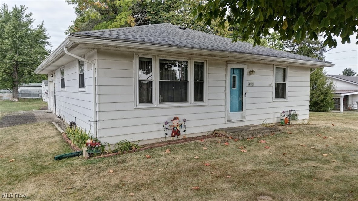 Charming 2 bedroom, 1 bath ranch style home. It features beautiful wood flooring in the living room, an open concept kitchen and dining room, and a full basement offering plenty of storage or potential for extra living space. Enjoy the convenience of an attached 1 car garage. The large backyard provides plenty of room and extra storage with a detached garage as well. This one level home combines comfort, functionality, and space inside and out!