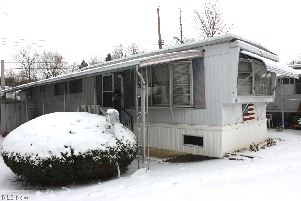 1969 Vindale (approx. 12x60) lot A-11 in Nimisila Estates mobile park off of E. Caston in City of Green* Well cared for, same owner approx. 29 years* Living room with 3 bay windows* Eat in applianced kitchen (range & newer refridge), pantry, corner cabinets in dining area & ceiling fan* Closet laundry including stack washer & dryer* Central air* Storage building* Full awning covered patio* Fully skirted* Nov. gas bill $48.00* Lot rent $265.00/month includes trash pick up & snow removal* Owner pays water & sewer (last month $21.73)* Adult community 55 & older* Convenient location & economical*