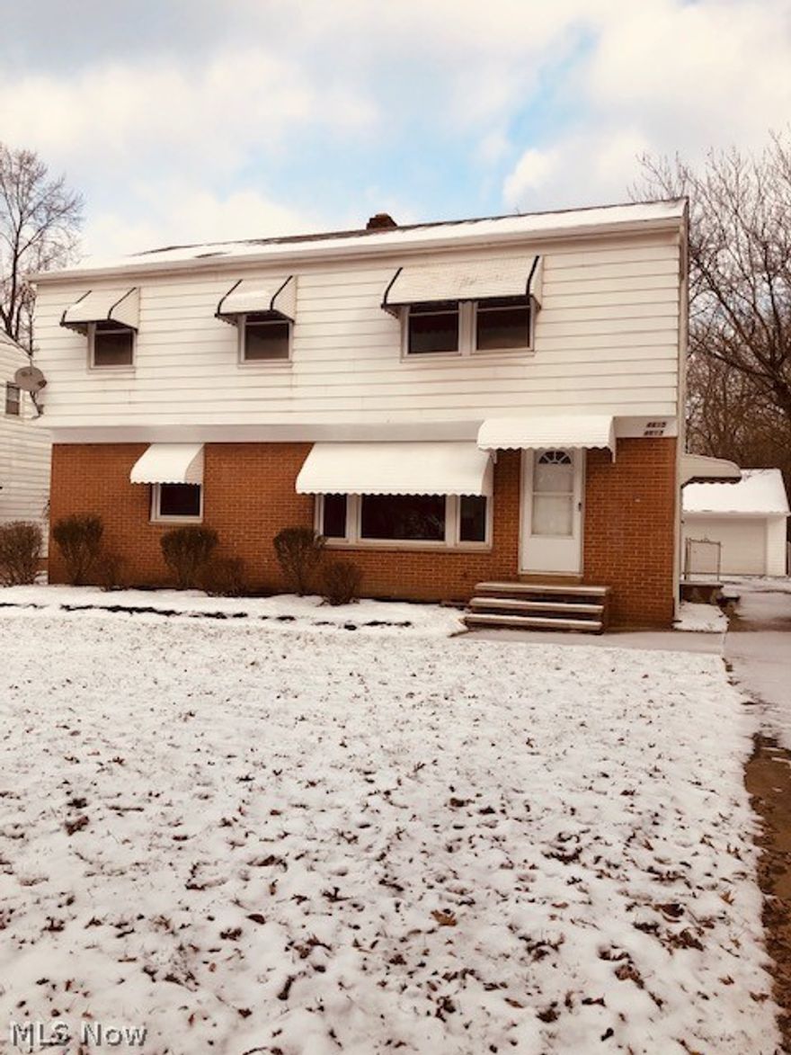 An AMAZING OPPORTUNITY to BECOME a REAL ESTATE INVESTOR OVERNIGHT!  IMMEDIATE INCOME!!!! This 1900+ sq/ft,  two family Garfield Heights Colonial is move in and RENT READY!!!  Ideal for an Owner Occupant!  The first floor unit is an oversized 2 bedroom, one bath; the upstairs unit is an oversized 3 bedroom, one bath. The property has been updated from TOP to BOTTOM, featuring two new HWTs, 2 new furnaces, updated electric, plumbing, fixtures, vinyl flooring, new carpet, updated kitchens, updated bathrooms, new interior and exterior doors, newer windows, fenced in backyard, resurfaced driveway, repaired chimney, repaired roof and many other finishing touches.  This uniquely designed two family offers large bedrooms, an open floor plan, plenty of parking, and large basement for plenty of storage.  Property being sold VIOLATION FREE.  This is a MUST SEE!  Schedule your private showing ASAP.