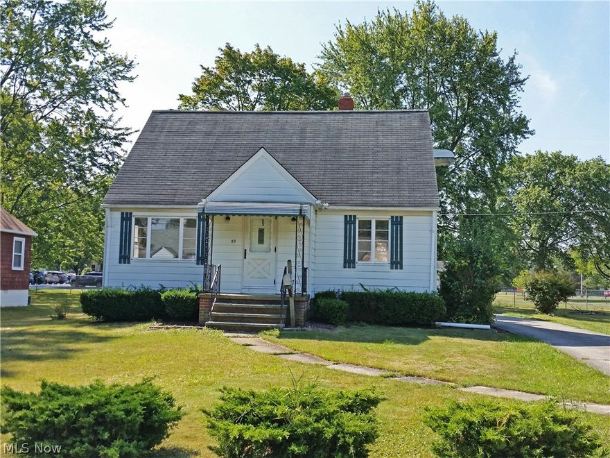 Cared for Cape Cod offers large rooms and lots of charm.  On double lot.  3 large bedrooms with natural woodwork and built-in cabinets.  Cute nook off kitchen and lots of cabinets.  Hardwood floors throughout.  Full basement.  Washer and Dryer remain.  Two car garage with newer doors.
