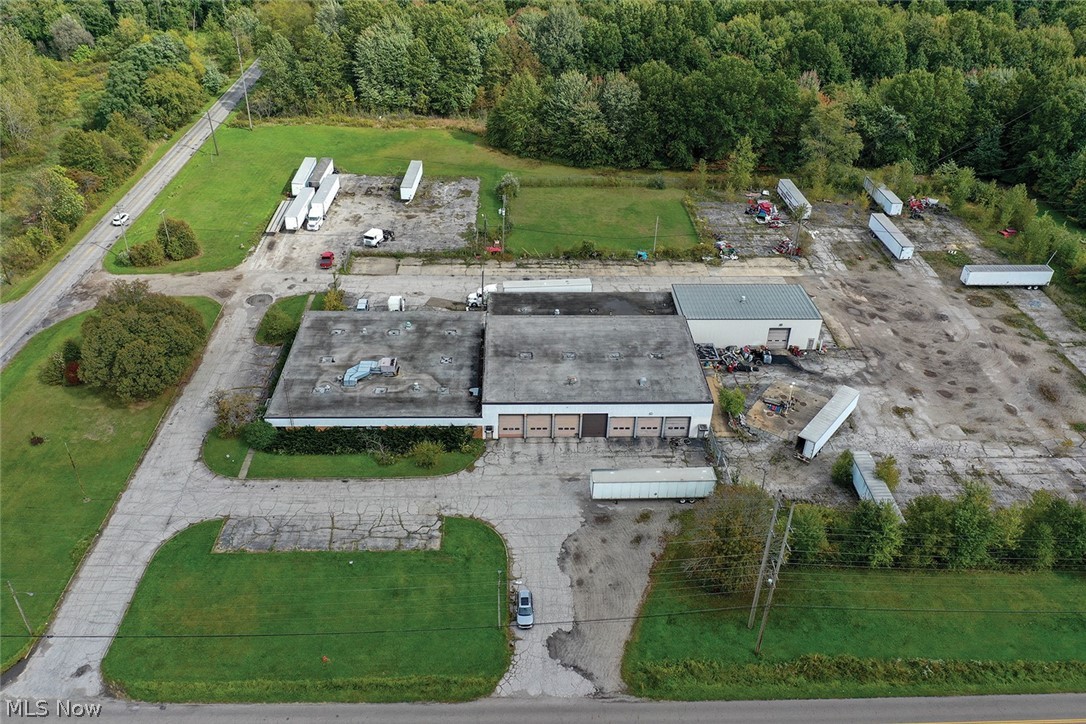 Court Order Sale Of Real Estate - 21.7 Acres With 25,000 Sq. Ft. Commercial/Industrial Building - Smith Twp. – Mahoning Co. – No Zoning - Sells on the location: THURSDAY – DECEMBER 8, 2022 – 12:00 PM. Built-in 1962 – remodeled in 1993 – originally owned by Ohio Edison – very well-built concrete block construction – steel and brick exterior, loads of parking – partially chain-link fenced. Approx. 16 roll-up doors – loading dock – offices – his and her glaze-tile restrooms – conference room – 3 large shop areas with roll-up doors – city water – 3 ph. electric service – photos, sketch layout on the website. Call for a showing or the property will be open for viewing on Monday, December 5, 11:00 AM-1:00 PM. Tax parcel #19-026-0-003.00-P & 19-026-0-004.01-0. Appraisal $564,000, cannot sell for less than 2/3 which is $376,000. TERMS ON REAL ESTATE: 10% of appraised value is due on auction day, balance is due at closing. A 10% buyer’s premium will be added to the highest bid to establish the