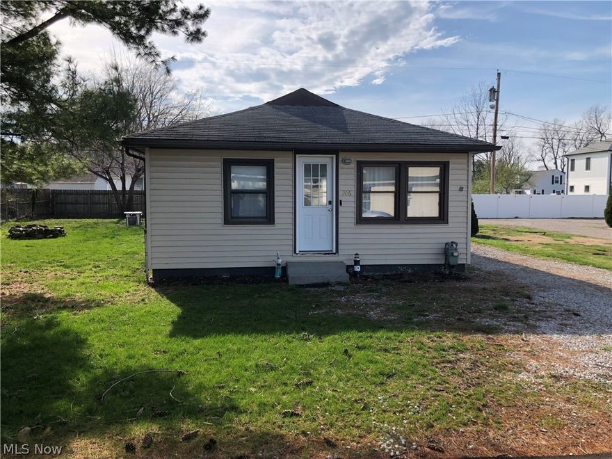 Welcome to this charming lake town cottage! This home offers first floor living with a large kitchen, sun porch, dining / living area, bedroom, and bathroom. It also features a second lot which is perfect for enjoying the outdoors of those warm summer nights. The detached garage is large and features a storage attic--giving you plenty of room for all of your vehicles, projects, and stuff. This home is perfect as a vacation home or a rental. Schedule your showing today!