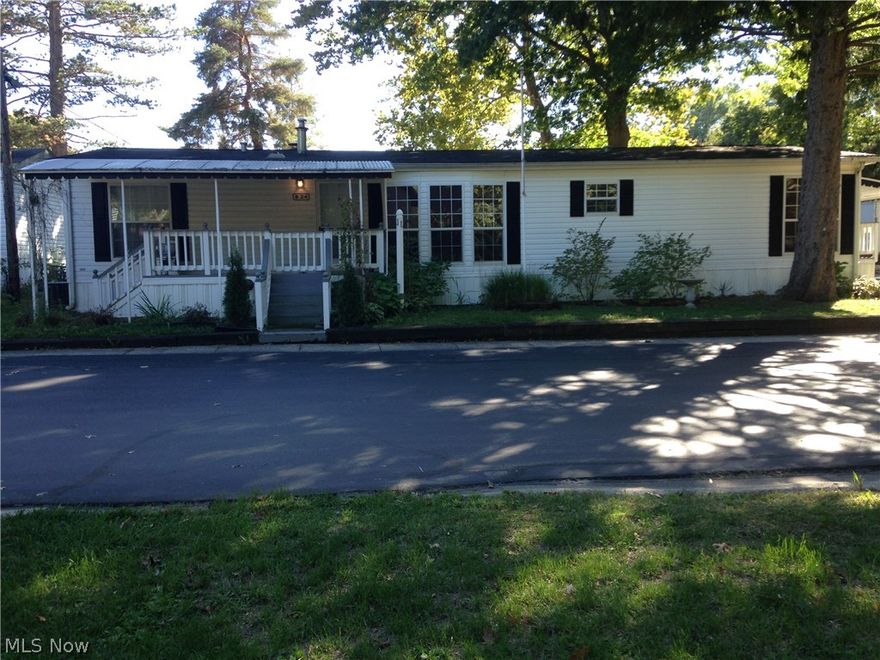 2002 Astro with integrated sound system & intercom.  Made for wheelchair-accessibility with wide doors & hallways.  Great tilt-in windows with cellular shades!  Laundry room w/utility tub. Kitchen w/HUGE pantry, built-in desk, broom closet, island w/gas cook top & beverage sink w/garbage disposal, double sink w/garbage disposal, tons of cupboards & countertop!  D/R w/bay window & built-in cupboard, crystal chandelier & vaulted ceiling. LR vaulted ceiling, ceiling fan, & gas log fireplace with remote. 3 BR, all w large closets, vaulted ceiling. MBA walk-in closet, MBA w/shower, grab bars, his/her sinks.  Unit also has a back patio & shed. Lot rent is $326/mo. Hurry!  Big price reduction!