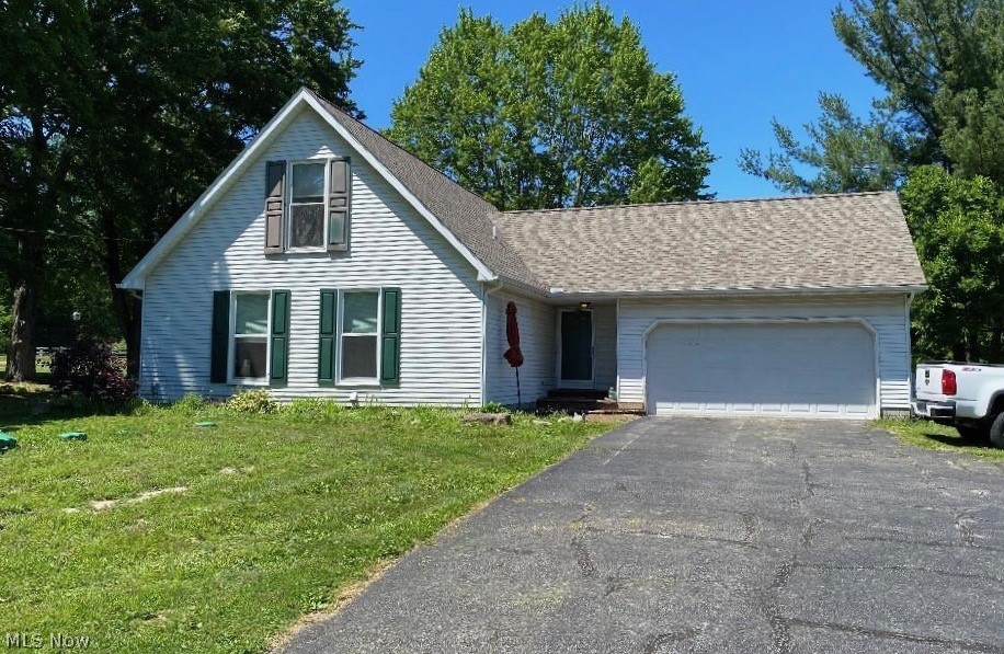Spacious Unique 3 Bedroom Cape Cod with Open Floor Plan Nestled on Almost One Acre! Extensive New Improvements Include Kitchen with Appliances, Including Induction Stove Top with Convection Oven, New Washer and Dryer. Replacement Windows First Floor. New Septic System. New Roof! Spacious Living Room with Vaulted Ceilings and Abundance of Windows Overlooking Backyard. Dining Room with Fireplace! Full Basement. 3 Patios to Enjoy the Backyard! Full Basement. Attached 2-car Garage. Older Barn on Property.