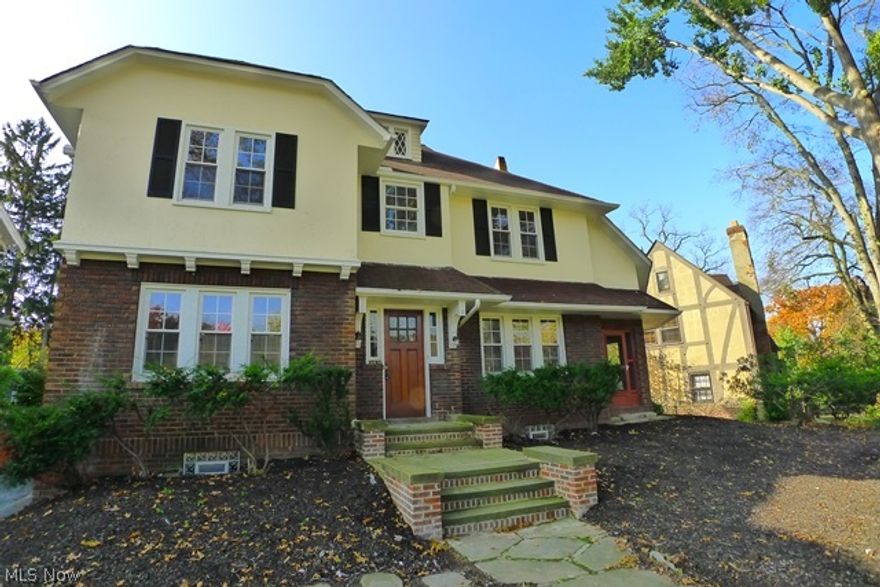 Spacious Colonial in a beautiful neighborhood has been recently rehabbed & updated throughout. 4 Bedrooms, 3 full bathrooms and 2 half baths.  Basement is a walk out and has a wonderful finished Lower Level Rec Room with carpet plus remodeled half bath and door to walk out.  Updated granite Kitchen with stainless steel appliances, wood cabinets, granite countertops, glass backsplash & ceramic tile floor. Open to Formal Dining Room with hardwood floors! Living Room has hardwood floors & wood burning fireplace and access to large three season sun room!  There are three bedrooms and two full bathrooms on the second floor - master has huge walk-in closet and the  master bathroom is gorgeous with walk-in shower! Fourth bedroom is on third floor with an updated full bathroom with ceramic tile surround and floor! Majority of the home has new windows. Garage has new garage door. Home is located close to shopping, Shaker Square, RTA with easy access to downtown.