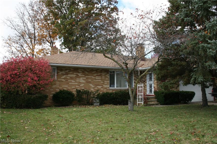 Brick ranch in a great location near shopping/restaurants.Spacious home with fenced yard and attached sunporch to enjoy the wooded and private yard. Full basement with rec room with fireplace and wet bar, lots of storage. 3 Bedrooms and two bathrooms. Two car attached garage. Living room with brick front fireplace and dining room. Wood floors throughout that needs some work to bring back to original glory or just add fresh carpet. Eat in kitchen. One Year Buyer Home Warranty. Roof 2007.