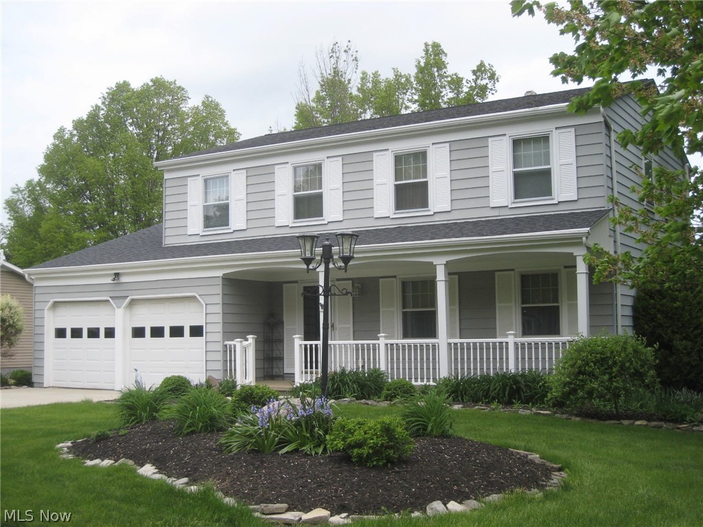 This meticulously updated colonial is move in ready. The front porch, that expands across the front of the home, welcomes you as you enter the foyer. The spacious living room opens to the formal dining room with beautiful hardwood floors. The updated kitchen features all appliances, 2 pantries and carefree Corian countertops. The "L" shaped counter is perfect for a breakfast bar, meal/baking prep. and entertaining. Step down to the spacious family room with fireplace and brick hearth. The recently installed French doors open to the 3 season sunroom, which is insulated and drywalled, and the beautiful outdoors. The perennial gardens, green space and patio create a feeling of peace and tranquility. The second floor features a Large master bedroom with hardwood floors, walk in closet, dressing area and a double step in shower (with a new frosted door). 3 more spacious bedrooms, all with hardwood floors, ample closet and storage space and a completely remodeled full bath that includ