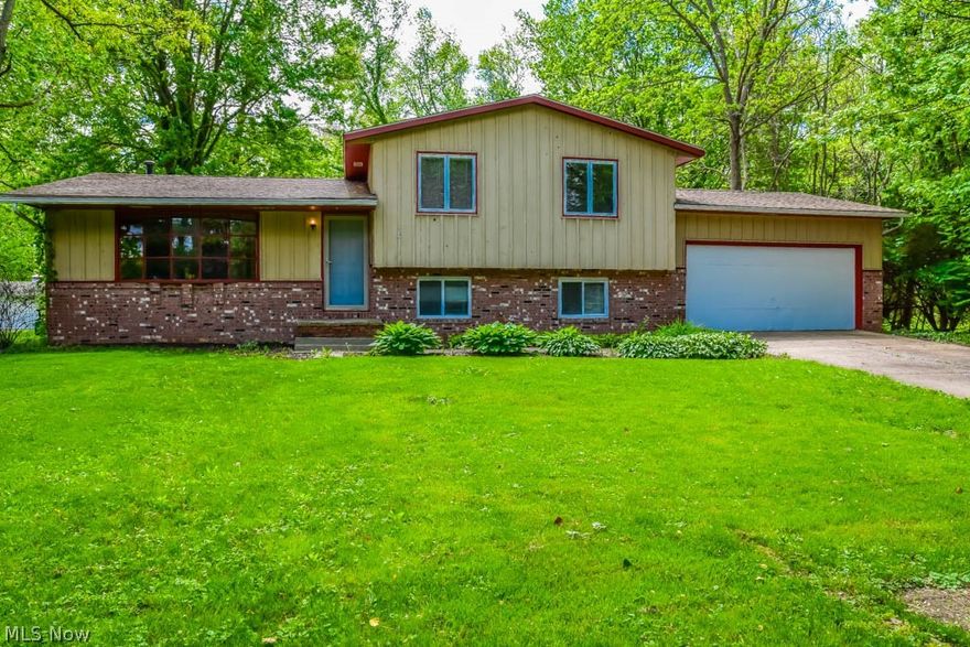 Multiple living spaces in this 4 bedroom, 2 full bath 4-level split! Gorgeous hardwood flooring greets you at the door as you walk into the spacious living room boasting a bow window. Open dining room with a chair rail and sliding door (2016) to the deck. Prepare your favorite dishes in the lovely kitchen with lots of cabinets, brand new neutral countertops, a pantry and a work station. It comes applianced with an oven, range, dishwasher and microwave. Upstairs, there are 3 bedrooms and a full bath with a dual sink vanity. Downstairs, the family room features a beautiful stacked stone woodburning fireplace. Around the corner, there’s a second full bath and a fourth bedroom. Brand new neutral carpet jut installed on the lower level! Ample storage in the basement and 2-car attached garage. Outside, enjoy a back deck, a patio, an aboveground pool and a storage shed for pool and lawn equipment! Just in time for summer barbecues! Updates made in 2016: new sliding back door, new windows on the lower level, new roof and exterior chimney. On a quiet cul de sac in Lake Schools. Come see all this home has to offer!