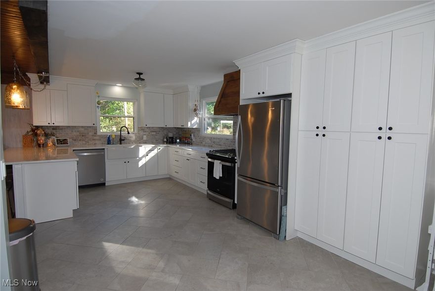 This 4 bedroom 3 bath home is fully updated. recent 22'x28' bedroom/bath addition with large walk in closet. Full additional basement garage/shop under addition plus 2 car basement Garage. Recently remodeled kitchen With plenty of counterspace. First Floor Family Room, Sunroom and outdoor patio area. Many recent updates including new metal Roof.