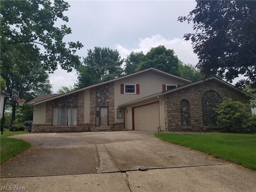 Welcome Home to 14731 Trenton Avenue in the Strongsville Chandler Commons Community.  Large Split level with 4 beds and 3 full baths.  The large kitchen features an eat in dining area, quartz countertops, island, oversized cabinets, two pantries and appliances including the new dishwasher. The kitchen is also overlooking the spacious great room with built in cabinetry, a bar area and wood burning fireplace.  Formal dining room opens to the large living room and both have cathedral ceilings.  The lower level has a full bathroom and bedroom.  The oversized 2.5 car garage provides entry to a very large laundry/mudroom with plenty of space and cabinets.  The large basement is currently a great space for storage or it could be finished.  The exterior features a large, landscaped yard with a patio and a parklike setting.  Chandler Commons is a wonderful community with walking trails, pool, sand volleyball, tennis, basketball playground, Pavilion and community activities.  Ask someone who liv