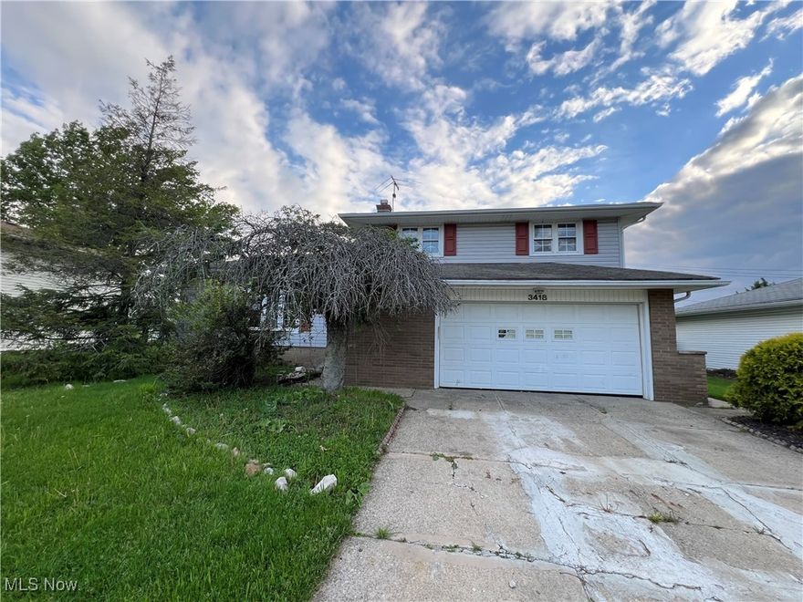 3 Bedroom Split level with 1 bedroom In-law suite.  In-Law Suite is large kitchen/living area with bedroom and attached bath.  Main part of house is 3 bedrooms up, 1.5 baths, lower-level family room and basement with rec room.  Home needs work.  Deck with large yard and shed.  Vinyl siding.  2 car attached garage.  Great location close to schools and shopping.  Call for your private showing today.