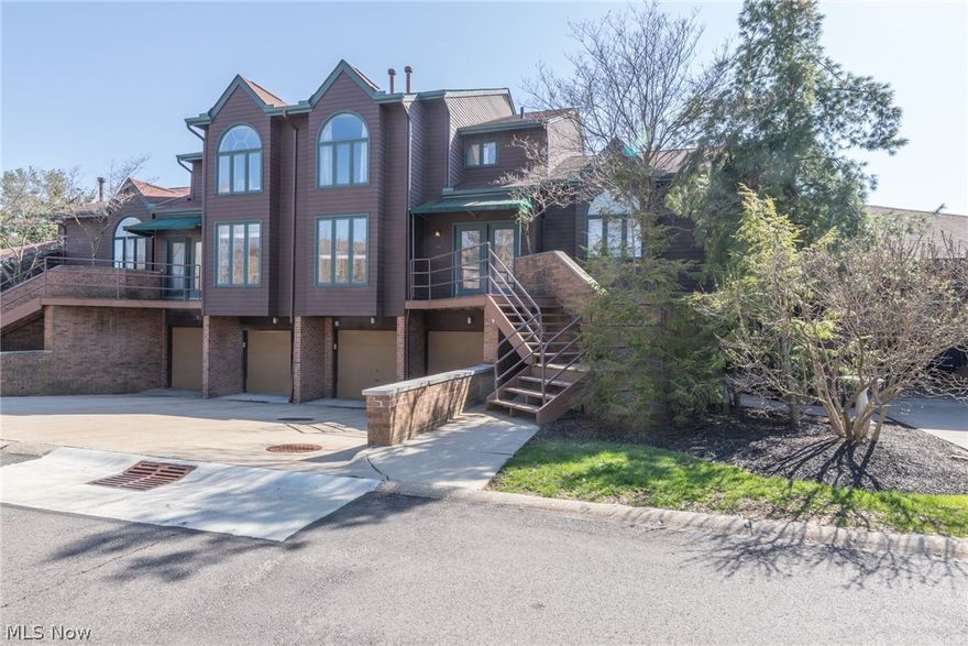 NEW PRICE! Find your updated 3 level townhome in the amazing Woodhawk community! Set in a quiet corner of the gated community that boasts 2 pools, fitness center, clubhouse access, tennis courts, indoor racquetball courts, sauna, 24/7 security and more! Step through the front door into a lovely foyer. Large updated eat in kitchen with granite counters, hardwood floors and newer appliances. Look out to the spacious great room with statement stone wall, wood burning fireplace and Pella french doors taking one out to a screened in patio. Remodeled powder room! In the lower level find a large multi-purpose room that walks out to a private patio overlooking ample backyard space. Walk upstairs and be wowed by the incredible 2-story loft area! Master bedroom enjoys a 3rd balcony, huge walk in closet and bathroom with heated floors, jetted tub, tiled shower and skylight. 2nd bedroom with en-suite bathroom! Enjoy the convenience of a private attached 2 car garage. Washer/dryer and digital nest