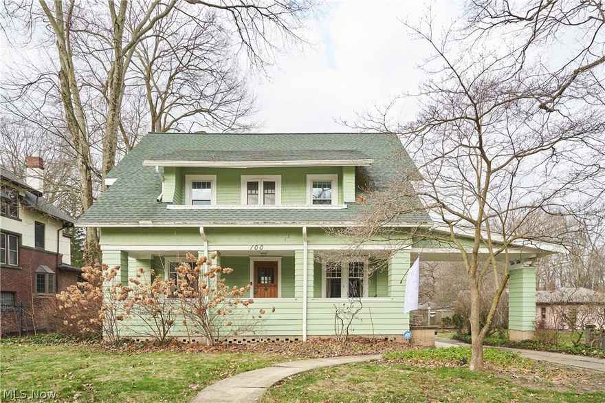 This residence offers an ambiance of old-world charm from the moment of entry.

*   The foyer showcases classic floor tile and the original front door.
*   The central hall features wood floors, providing views of the living room, dining room, and a classic staircase leading to the upper level.
*   The living room boasts a beamed ceiling, a raised fireplace mantle with a wood-burning stove insert. Glass French doors on either side of the fireplace lead to the sunroom, which offers desirable backyard views.
*   The dining room features a coffered wood ceiling, wainscoting, built-in cabinetry, and exquisite wood floors.
*   A butler's kitchen is situated between the kitchen and dining room, providing ample space for serving and entertaining.
*   The charming kitchen includes floor-to-ceiling cabinets, wood countertops, and tiled flooring.
*   A summer kitchen is located at the rear of the kitchen.
*   Upstairs, there are four spacious bedrooms, all with wood floors.
*   The primary bedroom features a walk-in closet and a double closet. French doors lead to a covered second-floor front porch.
*   Two bedrooms share access to a rear sun porch, and two bedrooms have access to a Jack-and-Jill bath.
*   Both second-floor bathrooms have been renovated.
*   The third floor features a large flex room, suitable as a primary or guest bedroom, complete with a full bath and a walk-in closet.
*   The property includes a large backyard and a two-car garage.
*   The boiler was replaced in 2024.
*   Split-unit cooling systems adequately cool the levels.