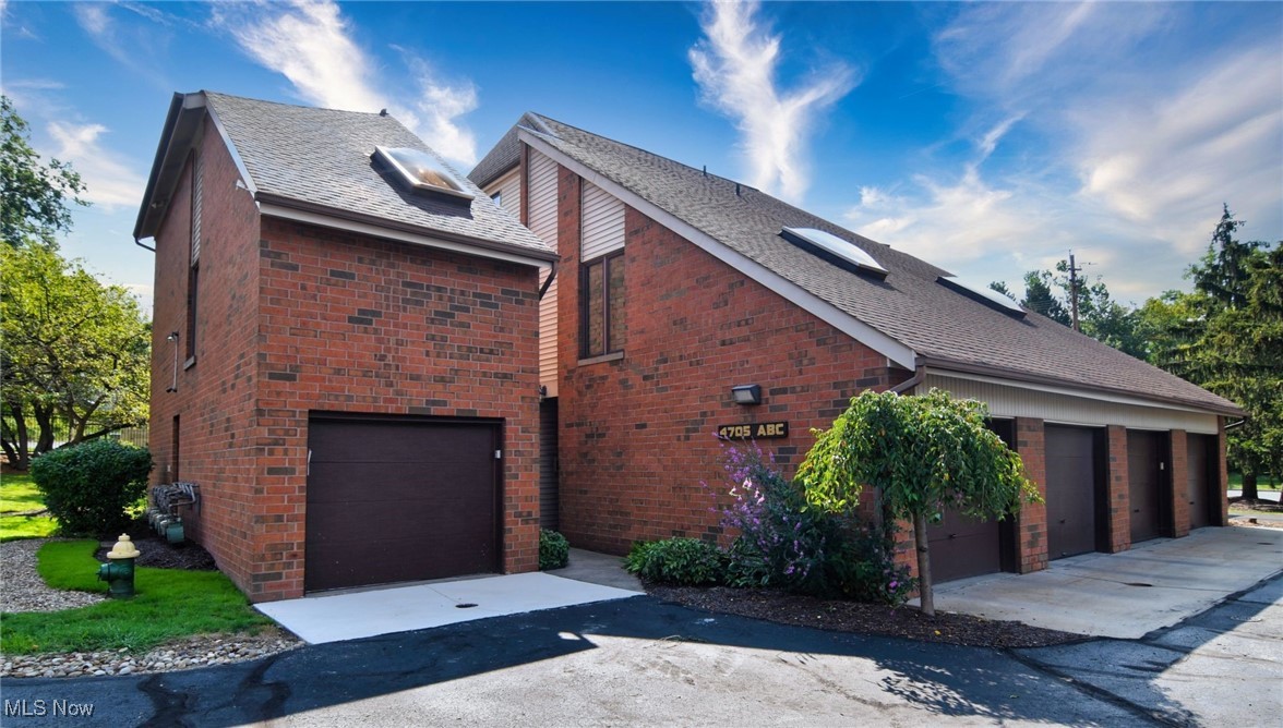Stylish multi-level 2bed/2bath condo in The Lofts, a highly regarded community with a phenomenal HOA, ample guest parking, and well-maintained grounds. Located in South Euclid! Moments from Shopping, Dining, and more! Attached 1-car finished garage with opener and fresh paint leads to a convenient landing with large coat closet, access to the private entranceway, and a laundry area with shelving, storage, washer & dryer set to stay. The main level offers a second bedroom with vaulted ceilings, skylight, and large closet, plus an updated full bath with fresh paint, modern flooring, painted vanity, and new lighting. The kitchen opens to a dining area with chandelier and a vaulted living room with balcony access. An extra-wide staircase with stunning wood banister detail leads to the primary loft suite, featuring a vaulted ceiling with exposed beam, skylights with internal blinds, spacious walk-in closet with custom organizer system in place, and a second large storage closet. HVAC is a 2022 Magic-Pak system; oversized water tank approx. 10 years old. Enjoy soaring ceilings, abundant natural light, and an open, airy floor plan in a prime location. HOA covers exterior maintenance, landscaping, and more...making this home as low-maintenance as it is beautiful! Please enjoy our attached video tour and request your private showing today!
