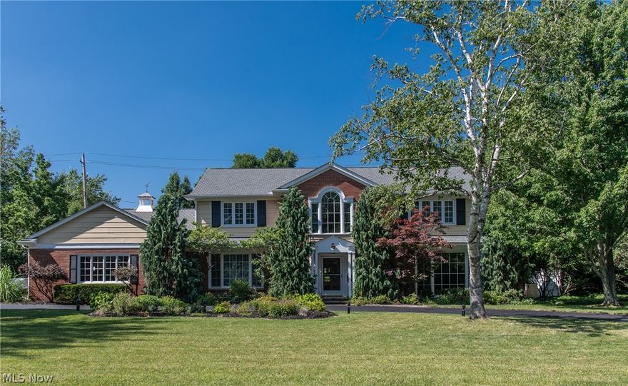 Classic and Elegant Center Hall Brick Colonial is situated on a half-acre charming lot and close to University Circle,Legacy Village,Beachwood Mall,shopping and restaurants.Sunny two-story marble entry welcomes you to this spacious home.Renovated large kitchen with custom Shrock cabinets (custom spice cabinet,vertical racks above oven,Pull-outs in all cabinets,large appliance “garage” and baking area),granite countertops,Double Jenn Air convection ovens,Dacor gas 5-burner cooktop paired with Thermador high output hood,is a chef’s dream.The home features 5 bedrooms,4 full,3 1/2 baths,living room, cozy family room with sliders to the sunroom and backyard,large dining room - all with energy-efficient glass.Master bedroom has wall of windows, plenty of closet space,remodeled master bathroom and a separate half bath.Four large bedrooms upstairs with two having en-suite full baths and the other two are Jack-and-Jill. Sunny three-season room with wood burning stove leads to patio with built-i