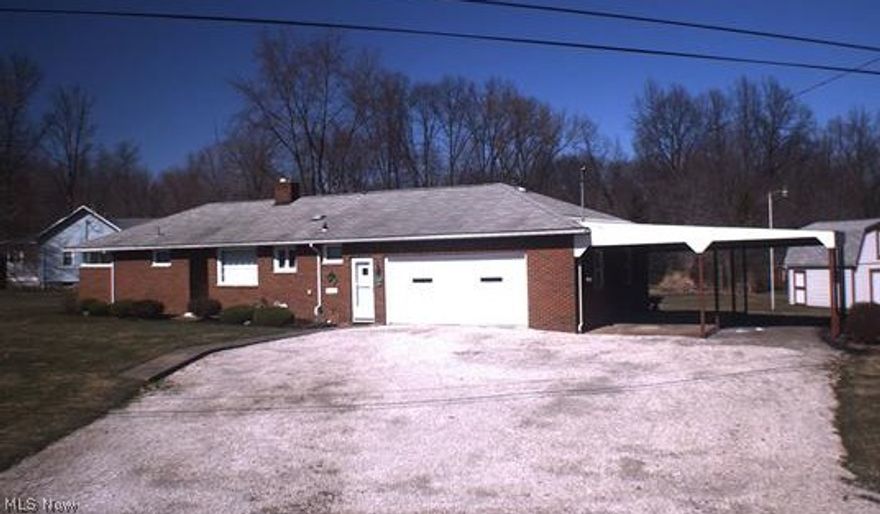 Exceptional high quality brick ranch on a double lot 222 x 150. Howland Schools, City utilities, 4 bedrooms, 2.5 baths, double attached garage plus 2 car ports. Birch trim, plastered walls, living room w/built-in cases, 2 kitchens w/appliances, rec room w/fireplace & workshop. Additional storage in large shed. A must see!