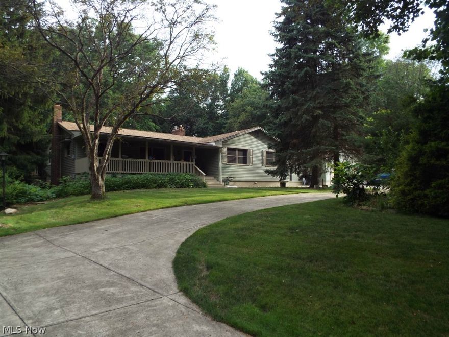 This is so awesome you've got to see it.  It's BIG, it has acreage, lots of bedrooms and baths! The roof and siding and windows are new.  There's a private master suite with a closet so big it's a room by itself (bonus room). If you need an in-law suite instead, it would suit itself well for that also.  The oak kitchen has cabinets galore,  2 pantrys, and a 9 foot long center island, with all granite countertops. First floor laundry.  Big circle drive in the front.  Two lots with 188 ft frontage each and they are both home to the wild turkeys and the deer. If you have the need for more than the oversized 2 car garage, there is another one out back and if you like to garden, you can get all your plantings started in the attached greenhouse.  Just in case you need more room, there are 2 rec rooms in the basement.  All this and just minutes to I 80, 680 and Rt 11 and the new Racino.  Must see AND easy to show.  Zoned agricultural.