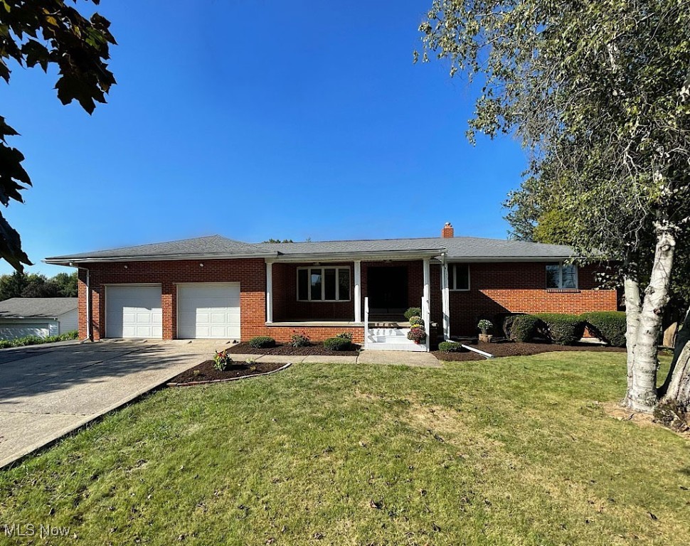 Remember the days of family gatherings when people brought their plates upstairs, downstairs, out to the deck, walked out to the yard, had great fun and just spent time together? This house will be perfect for that. Loaded with cherished memories and carefully-planned updates, this quality-built 5 bedroom, 'set back' ranch home has been in the same family for nearly 50 years. Conveniently located on 1.8 acres between Akron and North Canton, your first glimpse of the inside of the home is through a pretty double door entry, into a 19 ft. living room with bay window. The kitchen has an abundance of cabinet space, new countertops, flooring, and comes with all of the appliances. You'll love how it's open to a charming family room with fireplace, which will be just one of the fun centers of this home. The dining room will be great for intimate family dinners, and something you don't always find in a ranch home. A slider off of the family room leads to a 20 ft. long enclosed porch, and another slider leads out to a fantastic two-tier, raised deck and ground-level patio. You will spend a lot of time here. Both overlook a spectacular rear yard space, which includes a huge outbuilding for extra cars or yard implements, and a 50x25 ft. garden that in its day, grew every vegetable imaginable. The big walkout basement has two bedrooms, another full bath with a shower, an office, and a 42' room with fireplace that can be beautifully-finished to be an extra family room, work out room or playroom. If you like to tinker in an attached garage, this one is oversized and it even has a wash bay for your pup! The driveway is super long and there's a wide driveway extender, too. Together, they will hold a load of vehicles. Plus, there's even a carport! Add in numerous updates to bathrooms, the kitchen, lighting, new paint and carpet, and a community and schools that value family, tradition and student success, and this one is a sure winner. You will not want to let it get away!