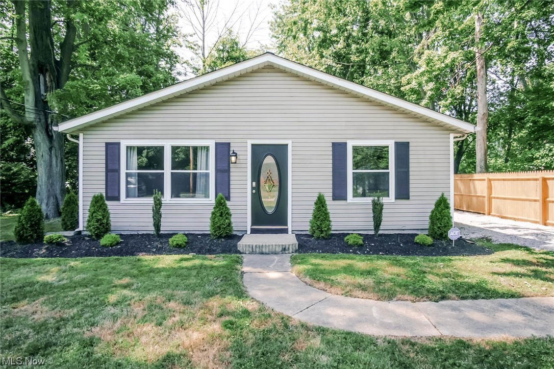 This charming 3-bedroom, 1-bathroom ranch home is currently operating as an income producing rental on Airbnb and VRBO. Whether you're seeking a serene full-time residence or an investment opportunity, this property has it all. The home boasts an inviting open kitchen and living room floor plan, making it an ideal space for relaxation and social gatherings. The home also features a large mudroom/laundry off the back of the kitchen which provides access to the backyard retreat. The backyard includes a new fence, fire pit, and solar lighting providing a private setting to entertain friends and family. You are only steps from the Lake Breeze Park, private to only nearby residents, where you can enjoy watching the sunsets over Lake Erie.