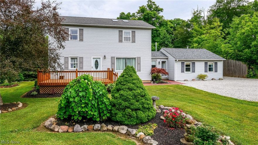 This spacious 3/ 4 bedroom 3 bathroom colonial is nestled on 5.43 gorgeous acres with a
pond, detached garage, and barn. The property itself is a nature lover or hunter’s dream with
majestic woods complete with old growth hardwood trees, a creek, and wide walking path
perfect for morning hikes.  The yard boasts a small orchard of apple and pear trees as well as a garden, a deck, and a large
brick patio with built-in koi pond, firepit, and gorgeous landscaping.
The main level has an updated hickory kitchen with brand new  black stainless steel
appliances, a dining room with original hardwood flooring, and a large living room with new
carpet . The unfinished basement has an updated gas furnace with central air, a new sump pump ,new water tank. The stairs leading to the upper level were built by the current owner using an Ash tree milled from the property. The second level features a beautiful master suite also handcrafted by the
owner. The master bathroom has ceramic tile, a jett