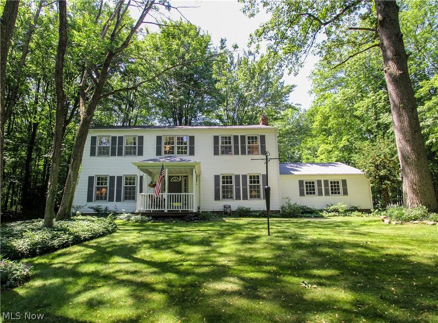 Set back 700 feet off the road this fantastic colonial has a  covered front porch that  leads to two-story foyer; Family Room with brick wood burning fireplace, wood paneled walls and oak hardwood floors; 4 season sun room with wood paneled walls walks out to huge deck that leads to an in-ground heated pool, huge backyard has a shed and two fire pits that overlooks the  wooded setting; new roof in May 2017, open eat in kitchen with Corian counter tops and large pantry; the  Living Room Dining Room combination offers oak hardwood floors; four bedrooms upstairs,  spacious master with walk-in closet and private bath; all solid core doors and solid wood trim throughout plus Pella windows; full basement with finished lower level with huge rec room with built-in bar; exterior landscape lighting on the house and down the driveway. Make your appointment now!