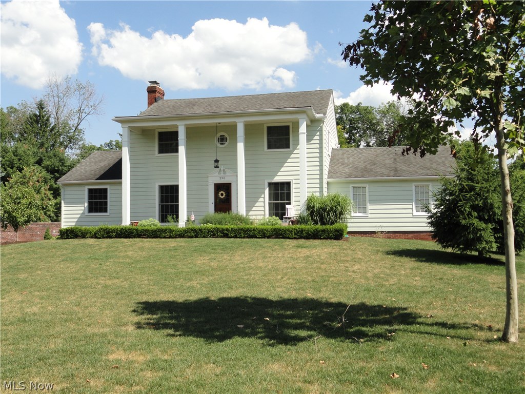 Charming classic Colonial in desirable Hudson location close to downtown! Situated on 1/2 acre and surrounded by the historic Ellsworth Estate brick privacy wall. Foyer entry to formal dining room or formal living room with crown molding, oversized windows welcoming the sunlight plus a wood burning fireplace. Cozy first floor den or office with second wood burning fireplace and built in bookshelves. Plus a first floor sun room with a separate entrance adding an additional 225 sq ft of living to the first floor. Gorgeous refinished hardwood floors throughout the house. Snazzy vintage eat in kitchen is bright and cheery! Master suite with walk in closet and private bath. Two guest rooms with jack & jill bathroom. Newer windows throughout, newly insulated and a high efficiency furnace too. Easy side entrance driveway and rear entrance garage plus generous sized private backyard to enjoy. Lovingly maintained plus tasteful decor makes this home a gem!