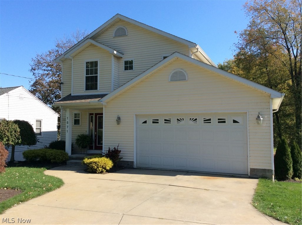 Charming colonial in desirable Ellet community. Large open floor plan with beautiful dark hardwood floors and stainless steel appliances. Living room, dining room and kitchen are all open and have access to a large deck with large stainless steel natural gas grill that stays with the house. Below the main floor is the finished walk out basement featuring a large family wood with wonderful views of the backyard. Through the sliding glass doors is a second entertaining Patio complete with Hot tub that stays. On the second floor are two bedrooms and a full bathroom as well as a the large master bedroom with large walk in closet and on suite bathroom. This home offer the complete package with the classic charm of a colonial with desirable open floor plan and hardwood floors. Lots of space for entertaining guest and enjoying all this home has to offer. Call today for a private showing of this home before its gone! Sq footage includes walk out basement