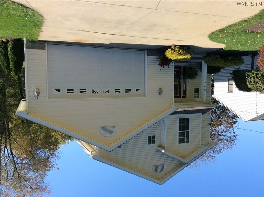 Charming colonial in desirable Ellet community. Large open floor plan with beautiful dark hardwood floors and stainless steel appliances. Living room, dining room and kitchen are all open and have access to a large deck with large stainless steel natural gas grill that stays with the house. Below the main floor is the finished walk out basement featuring a large family wood with wonderful views of the backyard. Through the sliding glass doors is a second entertaining Patio complete with Hot tub that stays. On the second floor are two bedrooms and a full bathroom as well as a the large master bedroom with large walk in closet and on suite bathroom. This home offer the complete package with the classic charm of a colonial with desirable open floor plan and hardwood floors. Lots of space for entertaining guest and enjoying all this home has to offer. Call today for a private showing of this home before its gone! Sq footage includes walk out basement
