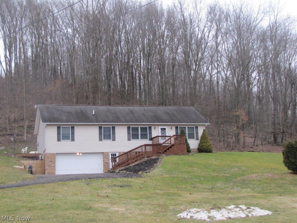 Updated ranch home that sits on 4.291 acres and consists of 3 bedrooms and 2 full baths on the main level. The property also features a kitchen, living room, family room and a partially finished walkout basement with another kitchen, rec room, bedroom and a full bath. A 2 car garage is attached to the home and a 24 x 36 pole building also accompanies this property. Property is mostly wooded.