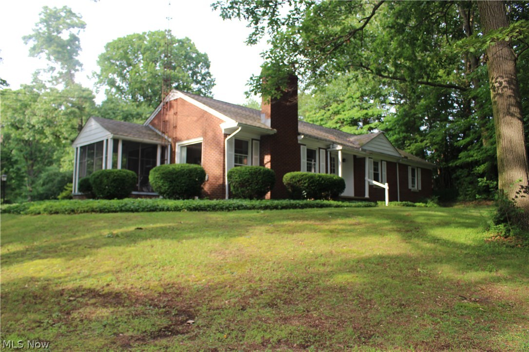 Welcome to this lovely all brick ranch! this 3 bedroom 2 full bath home sits on a beautiful park like setting on over 4 acres with a 5 car garage! Bright and Cheery living space with new windows (2006). Open kitchen with island. Wood burning fireplace. Large master bedroom with en suite bath. Charming screened in porch! Basement offers additional square footage of living space and storage. Very neutral throughout with new carpet (2015). Additional updates include new shower surround 2017, furnace 2006, Roof 2006. This one is not to be missed!