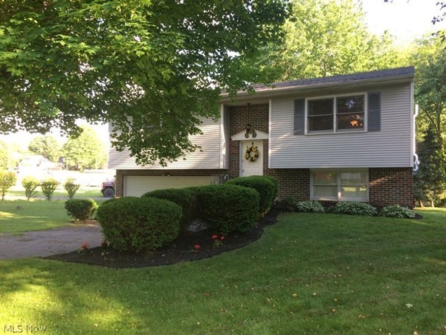 Wow!  This beautifully maintained home won't last!!  Immaculate and updated home is in great area close to Portage Lakes.  Nice well manicured lot with a park right across the street.  Nothing to do but move right in.  The lot is beautiful with flowers and shrubs.  There are two bedrooms and two baths on the main level and another room on the lower level that could be used for a third bedroom, office or craft room.  All appliances stay except the microwave.  
A home warranty is also being offered with the listing.