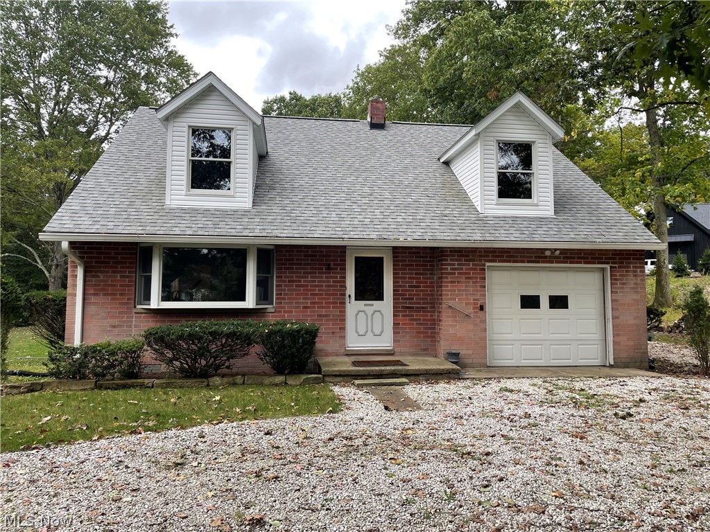 A remarkable all brick cape cod on 2.23 acres of pure beauty. Enjoy the peace and quiet in the deep wooded back yard. You will also enjoy the tranquility of the stream/creek that flows through the property. The upstairs just needs a little bit of carpentry to make this home a 2 or 3 bedroom home as the newer roof has been dormered which could add over 500 square feet. The huge living room is 19x15 and has natural wood floors. An eat in kitchen enjoys the beauty of the rear yard. An attached garage, large patio, and multiple sheds are just some amenities. This home may sit on a large piece of land, but it is close to shopping and easily accessible to anywhere.