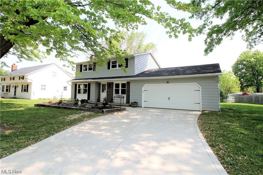 Welcome to this stunning, updated four-bedroom colonial home. Come on up the newer driveway, & gorgeous landscaped (2023) front yard to inside where you will find newer vinyl plank flooring, freshly painted, newer carpet (2020) throughout, windows all replaced (2020), & a vent free fireplace (2020) in the large living room where there are plenty of windows for natural sunlight to shine in & a glass slider door leading to the newer back patio where you can sit out & enjoy a morning cup of coffee. The bright, open dining room leads to the beautiful kitchen offering abundant of new cabinets (2021) with under cabinet lighting, newer counters, stainless steel appliances, newer faucets, lighting & newer garbage disposal. WOW! Totally remodeled first floor half bathroom offering new counters, vanity, & toilet. Upstairs you will find four bedrooms, with a master suite that has a walk-in closet. Totally redone full bathroom with new vanity, sink, counter, faucet, toilet, backsplash & tile showe