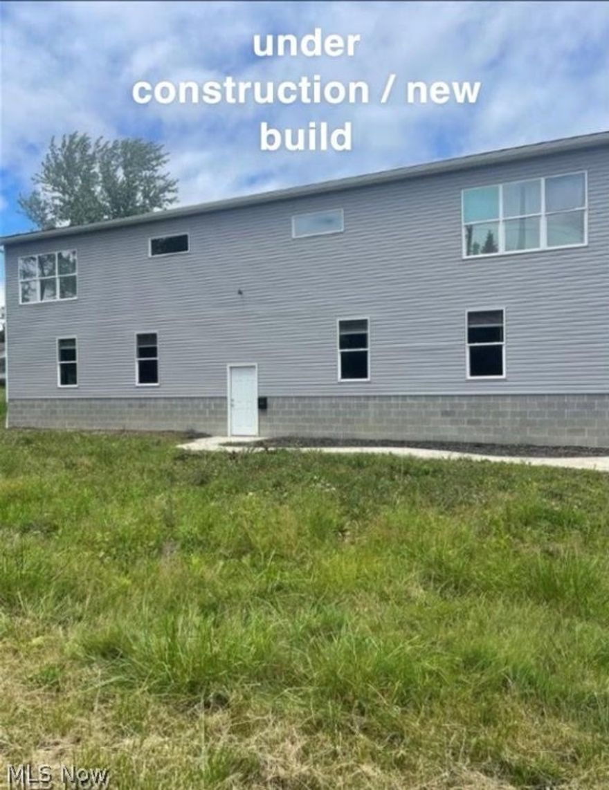 New construction in need of finishing work on 1.9 acres. The water well and septic system have not been installed. This home is designed to have approximately 2,300 SF of living space on the upper level, consisting of 3 bedrooms, 1 full bath, kitchen, and living areas. The lower level is designed for a 36x64 garage space with (2) 9 x 10 and (2) 10 x 10 overhead doors. The home currently has rough-in electric and plumbing. A new gas furnace is installed, but not hooked up to the gas supply line. NIB central air unit will transfer with the property. 200-amp main electric service installed. Cash buyers only.