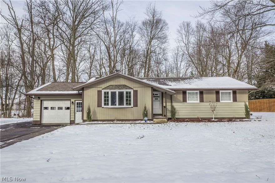 Completely remodeled Ranch home loaded with all the extras including an Incredible 3+ detached outbuilding for Car enthusiasts or hobbyist. All new luxury vinyl floors, fresh paint, new light fixtures, electrical plugs & switches throughout the entire home all completed in 2023! Gorgeous open eat-in kitchen with new cabinetry, countertops, sink & stainless steel appliances. Spacious living room & dining room plus a warm and inviting sunroom off the back of the home with wood burner. Full remodeled bath with double vanity.  Full finished lower level with enormous recreation room featuring new carpet and gas fireplace. All this and more situated on a park like .72 acre lot also includes a penned area.  This home is Awesome and will not last!