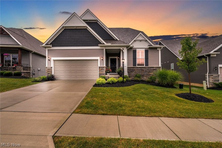 Step inside this beautiful Pulte Ranch Home in The Ledges of Avery Walden. This home features the "Ascend" ranch floor plan with a full finished walk out basement, backing up to heavily wooded Lake Metro Parks preservation land.   This is an exceptional, move in ready home awaiting its new owner to enjoy so many upgraded features.  The large open foyer welcomes you with soaring 9’ ceilings and beautiful LVP plank flooring throughout the main living areas.  The chefs kitchen is light and bright with upgraded stainless steel appliances a gas range  granite countertops, tile back splash  and soft close cabinets.  The open floor plan offers viewing access to the Gathering Room, Café and Sunroom.  A second story Timber Tech deck has been added for maximum relaxation.  The fabulous Owner Suite features a large private bath with a sit down vanity, large tile walk-in shower and a generous walk-in closet.   The basement offers soaring ceilings, an abundance of living space for an entertainment