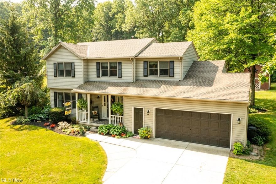 BEAUTIFUL 1996 built colonial (with numerous updates since built) tucked away on a scenic .98 acre homesite in Elyria Township placing you just minutes from I-90/80/57! Striking curb appeal with nicely appointed exterior and landscaping. Warm and inviting interior in neutral paint tones! Oversized foyer entry with walk-in closet! LVP wood floors accent most of the first floor (except family room). The living rm could accommodate as a dining rm. The kitchen is the star of the home! Tastefully renovated in 2018, you'll find it spacious w/ all the bells+ whistles. Quartz tops/white cupboards, farm sink, snack bar, 3 pantries, built in bar, open shelves, pull outs, stainless steel appliances! Dining area is complete with chair rail+custom lighting. Family rm w/ brick gas fireplace. Upstairs you'll find four well appointed bedrooms. Owner's bedroom is spacious with ensuite full bath (quartz counter tops/updated floors). FALL in love with the parklike backyard setting among a mix of mature trees including several pine trees! The back decks are the perfect space for entertaining, complete with a 16x29 lower level deck that leads to an upper level deck surrounding a 27' above ground pool! Raised bed garden! 12x16 two story barn with electric and built in workbench. No HOA and TWP living, plenty of space for your boat/RV storage! Roof, furnace, h20 tank and a/c have been replaced aprox.8 years ago! Pride of ownership gleams! Great price per sq ft for the land & condition!!!
