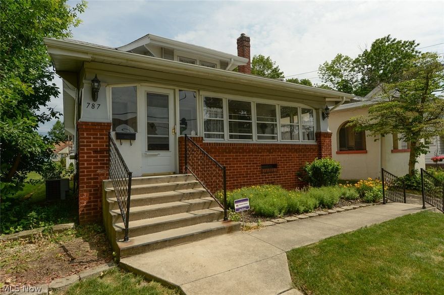 Beautifully maintained home with lots of updates and tons of original charm.  All new carpet throughout the first floor!  Brick fireplace and wooden book shelves in living room and bench with built-ins in dining room.  Spacious kitchen with lots of counter space.  Dishwasher, refrigerator and gas range are all included.  Second floor can be used as a one bedroom apartment.  It would also be great as a master suite, in-law suite or private living space for young adults.  This area has a small bedroom, open living room, complete eat-in kitchen and large bathroom.  You will find even more living space in the partially finished basement with a half bathroom and stand alone shower.  Updated electrical, sump pump and the washer and dryer stay.  Enjoy the neighborhood while sitting on the lovely enclosed front porch.  The well manicured back yard is the great for children, pets and gardening.  This home provides options for all of your needs.  Call for your showing today, to see how perfect i