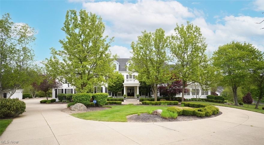 Architecturally impressive, this spectacular sprawling estate on 2.6 ac presents impeccable craftsmanship and brilliant appointments throughout.  Pillared formal living rm (w/frpl) & dining rm with hdwd floors and crown mldg. Awe-inspiring two story great rm highlights wall of windows, gas fireplace flanked by custom built-ins, full wet bar w/seating, view of 2nd fl. mezzanine/balcony, extensive cr. mldg, and outdoor access.  Impressive state of the art kitchen, w/beamed ceiling, offers SS appliances incl dbl ovens and full size freezer and refrigerator, granite, immense breakfast bar, ctr island, and separate eating area w/slider to patio.  Handsome office boasts gas frpl and wet bar.  An in-law/teen ste features a spacious white kitchen/liv rm/bdrm/bath/laundry rm and access to 2nd floor bonus/billiard rm (and entire 2nd fl).  Fabulous addition includes large tiered theatre room, art gallery, half bath, and expansive 2nd floor owners ste with balcony deck. French doors to owners suit