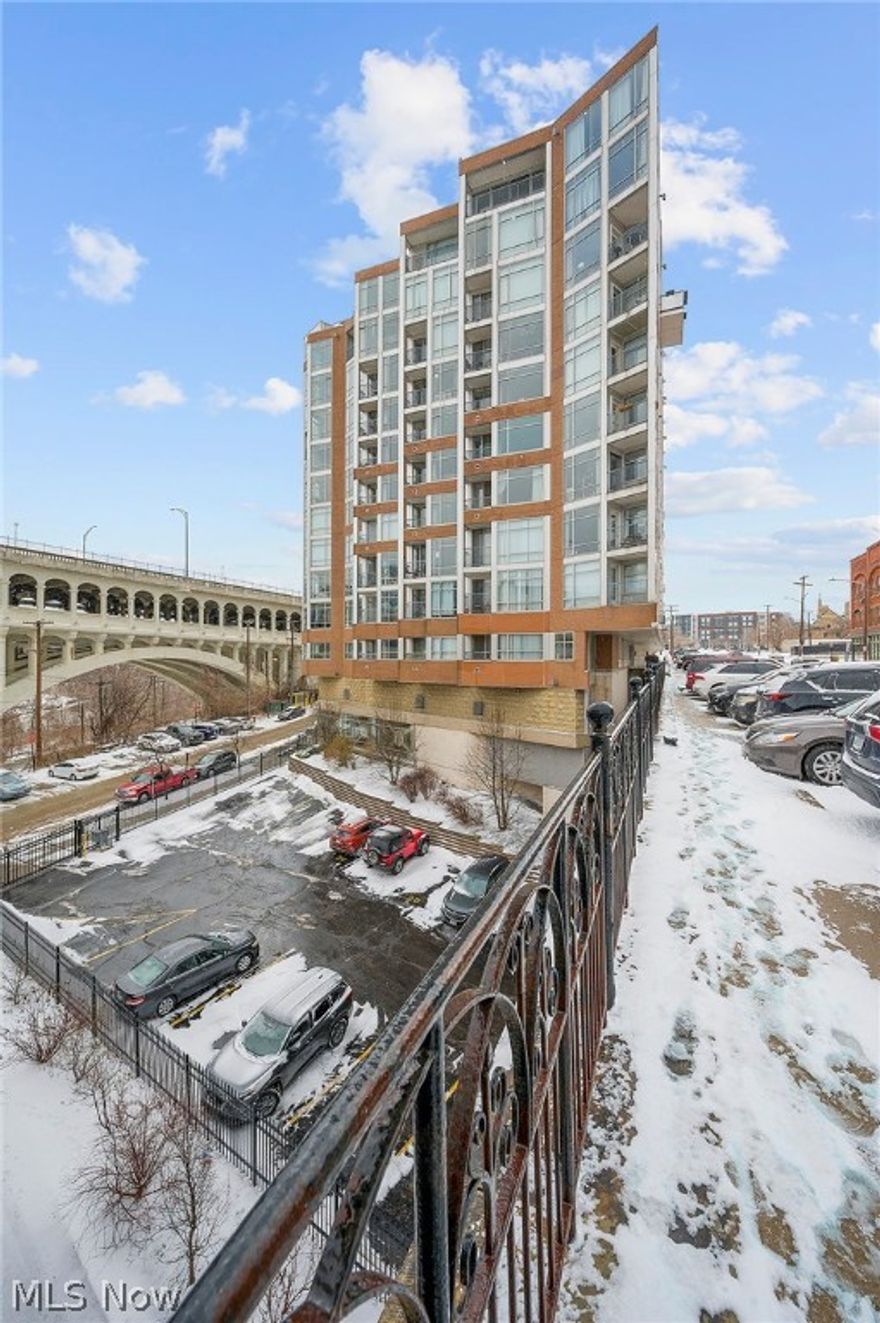 Wonderful Stonebridge  unit with newer 2022 refrigerator, microwave and stove. Maple cabinetry and open kitchen concept to living area with beautiful views of bridge and city! Two bedrooms with 2 full baths and one INDOOR parking space (#30 in P1 parking garage) AND lot #2 in gated area...hard to find a 2 bedroom with 2 designated spaces!! Stonebridge includes a fitness room/package delivery room/3 elevators and full time front desk concierge.  Access is with electronic key throughout building. Enjoy amazing Restaurants on the Superior Viaduct and easy access to W. 25th and Market. Development and further access to the flats and all the Cleveland hotspots will be starting soon.