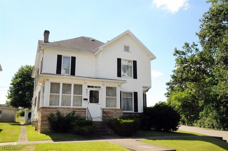 What a great value! Call now to make this spacious American classic yours! You'll be amazed at the spacious rooms and the most gorgeous gleaming woodwork throughout. The lovely fireplaces, original to the home, are both decorative and add a delightful focal point to each living room. The formal Dining room boasts a beautiful oak built-in cabinet. The full basement may be entered from in doors or out. The charming enclosed back porch makes for a cozy area to relax and sip a glass of lemonade. The inviting front porch is rocking chair ready. The level, corner lot has two storage buildings and still plenty of yard to enjoy. The MWCD Assessment is $6.00 per year. The property taxes without the homestead credit are $796.94.