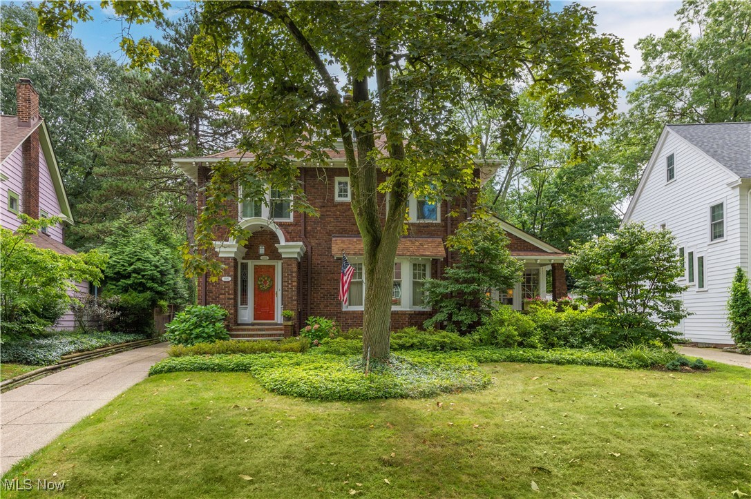 Welcome home to this beautifully preserved all-brick historic Colonial in Cleveland Heights’ prestigious Cedar-Fairmount neighborhood. Rich with original character yet thoughtfully updated, it combines old-world craftsmanship with modern comfort. Step through leaded glass entry panels to gleaming hardwoods, crown molding, and a custom-tiled gas fireplace. A bay window brightens the living room, while an adjacent sunroom with built-in shelving opens through French doors to a private landscaped patio. The formal dining room continues the hardwood floors and crown molding. A stylish half bath and cozy office nook add function. The kitchen features porcelain tile, maple cabinetry, stainless steel appliances: GE range (2024) Bosch refrigerator (2022) Frigidaire dishwasher (Aug 2025) A three-season room overlooks the backyard. Upstairs, the primary suite has a walk-in closet & two more bedrooms. The updated master bath features a walk-in shower and soaking tub. The finished third level with ensuite is ideal for a second master or guest suite. VIOLATION FREE with Cleveland Hts. Upgrades include generator (2016) hot water tank (2024) painting (2018) basement waterproofing (2013) Anderson and Pella windows, and garage updates. One block from Euclid Golf District and Forest Hill Park, near museums, dining, Case Western, Cleveland Clinic, and University Circle.