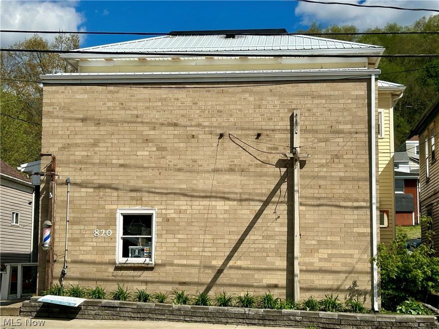 A must see to believe, the opportunity to own your own business (presently a beauty salon for 30+ years) and rent two fully renovated apartments in the heart of Wellsburg with modern finishes and updated amenities. Metal roof is 2 years old, electric panel was updated 1 year ago, dual furnace & AC are 10 years old, 3 car oversized garage with 9 foot door, new garage opener with 4 controls, new hot water tank, updated kitchen with high-end granite counter top and island on main floor, private comfy porch, walk-in showers in each apartment, new flooring, laundry on each floor, and large oversized rooms with lots of closets and storage. Call today for a once in a lifetime opportunity.