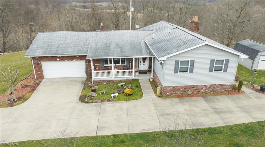 Bring your horses!  Beautiful 3 bedroom, 2 bath home on 34+/- acres with spectacular views.  Tastefully updated with pre-engineered hardwood floors.  Updated maple kitchen with pull out shelving, breakfast bar and stainless steel appliances.  French doors lead to the sun room with access to the deck.  Heated, ceramic tile floors in the main floor bath with double sinks, granite counters and walk in tile shower.  Walk in closet in the master bedroom.  Lower level finished with rec room, laundry room and full bath.  The rec room features a brick wood burning fireplace.  A full kitchen in the lower level features a breakfast bar and includes range and refrigerator.  200 amp electric with generator.  Gun safe and ring door bell included.  2 car attached garage with opener.  Peaceful 34+/- acre setting includes 14+/- acres fenced.  The property features an 8 stall horse barn, metal pole barn and riding arena storage barn with opener, perfect for your animals.  Original owner!  Mineral right