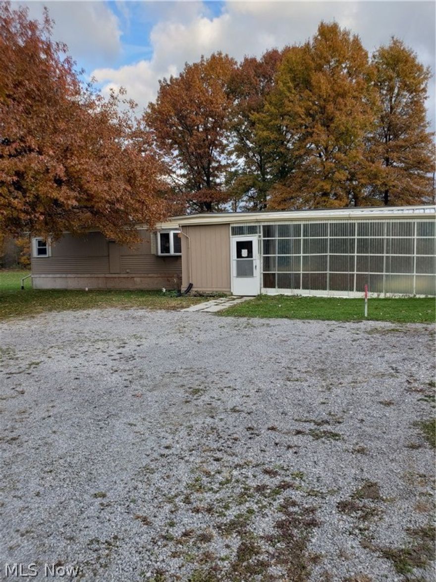 Unique property with great income potential.  Well kept home with newer 2 car garage available for owner occupant or rental.  Currently there are 3 additional rentals on the land generating over $1,100 per month that would like to stay.  This would also be a beautiful piece of land to build your dream home.  Many possibilities here!