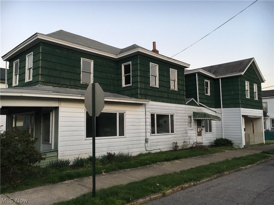 Main house consists of 3 bedrooms & 1.5 baths.  Apartment in back of house consists of one bedroom, bathroom, living room & eat in kitchen.
Corner lot.