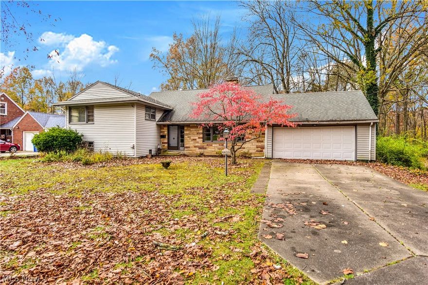 Adorable home located on Beautiful Mill Creek Blvd, with Award Winning Boardman Schools! This 4 bedroom, 3 full bathroom home has a lot of nice features. When you first walk in the home the foyer is large and spacious with the living room to your right and the stairs leading to the upstirs to your left. As you walk into the large Livingroom you will see that it is open and airy with lots of natural light coming in from the front windows, the fireplace is grand with ceiling to floor hand laid stone. Off the Livingroom is the dinning room, perfect for entertaining, and it flows right into the kitchen that has plenty of counter space and cabinets for all of your kitchen gadgets, an added bonus is that there is also a kitchen dinning area, and a door that leads out to the BEAUTIFUL Large park setting backyard. Upstairs there are three bedrooms, with a Master Ensuit, and a fourth bedroom on the lower level. Also on the lower level is an office that can be used for a toy room, game room, man
