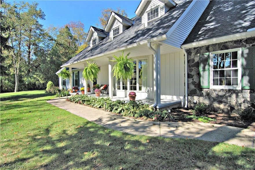 The inviting front porch leads you into this beautiful home.  From the foyer (HDW) is access to the living room with bayed window, dining room (HDW), 
family room (HDW), and staircase to the second floor and basement.  A gas fireplace graces the family room with access to the yard, side hall (1/2 bath), 
2 car garage and kitchen. The kitchen is the hub of this home.  You will love the immense areas of granite making room for baking, food prep and serving.
Beautiful hardwood floors are in the kitchen and ample eating area. Range with 2 ovens. Off the kitchen is a suite area with full bath, pantry and office/
bedroom/sewing area (you decide).  This home has versatility. There are 5 bedrooms up and laundry area.  One of these is also perfect for a study area or playroom (20x11). All of the bedrooms are generous. The full basement has a half bath.  It is 50% finished and has larger than usual windows for good lighting.  The other half is separated into an excellent shop area and a util