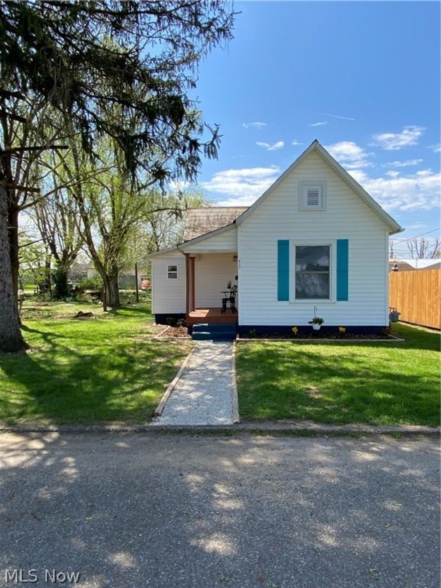 Affordable, adorable, completely gutted and remodeled home. This 1 bedroom, 1 bath home is so much bigger than the square footage shows because of the openness. Great starter home or for downsizing. All new kitchen (flooring, cupboards, counters, sink, island, lights) with a hint of color is open to the living room with new flooring. Bathroom was moved to make it larger.  A walk-in closet (complete with a vanity and rustic shelving) was added to the bedroom. New back deck that is assessable from bedroom, makes a great late night sitting area. Large laundry room was added off the bath. Updates include flooring, plumbing, electrical, all new windows, porch, deck and so much more. Large, flat back yard with a cement parking pad. New landscaping complete with flowers. Front and back door POPS with a splash of attention grabbing color. Roof does NOT leak but seller was planning to install a metal roof but ran out of time, therefore is giving a $3,000.00 roof allowance. Don't miss this gem!